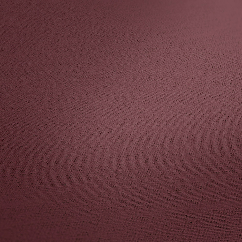            Papier peint uni Bordeaux rouge avec aspect textile
        
