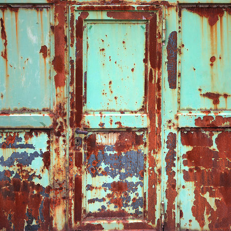         Rust mural with metal door in used look
    