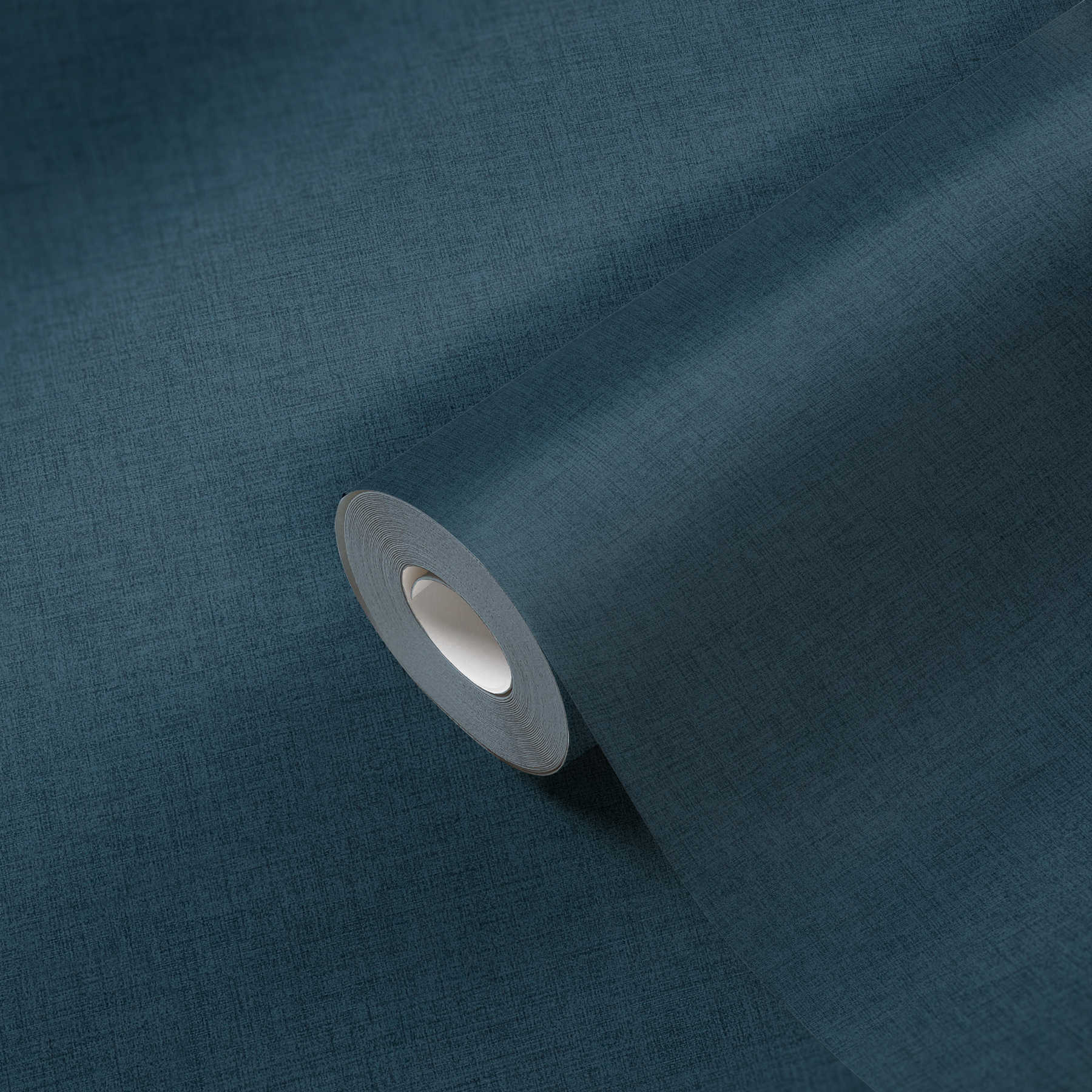             Linen look non-woven wallpaper in petrol blue
        
