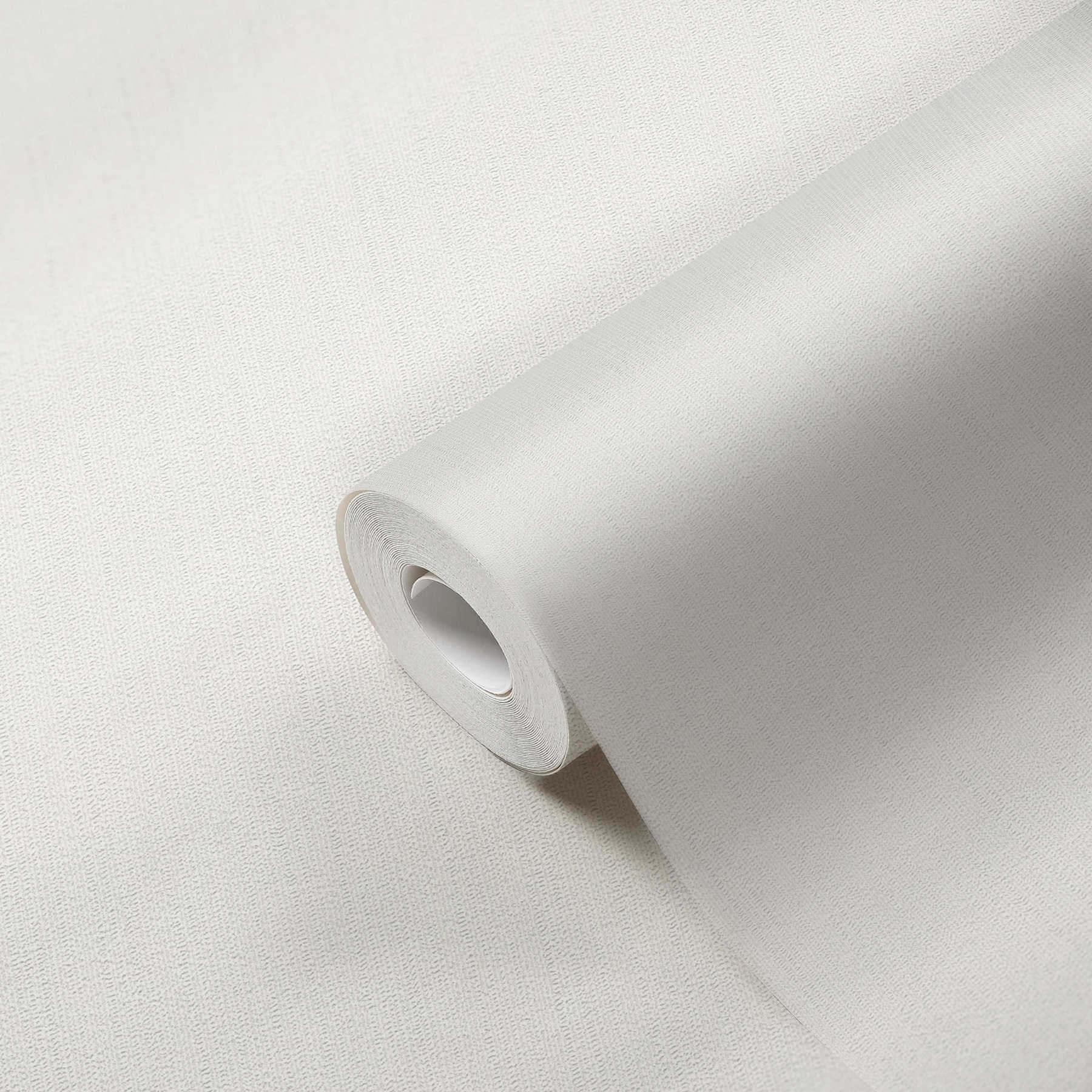             Papier peint intissé blanc uni, mat avec structure de mousse
        