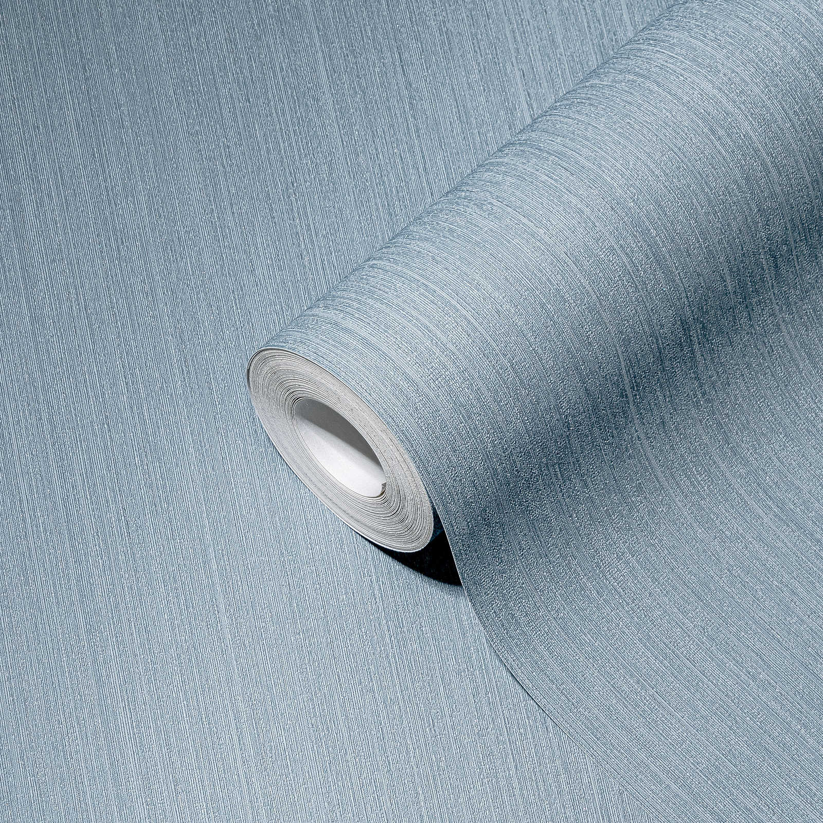             Blauw vliesbehang effen, zijdemat met textuureffect
        