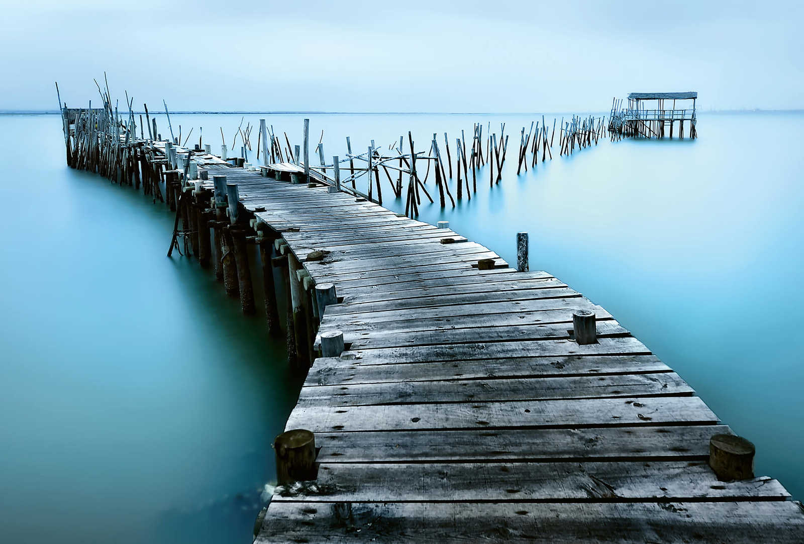 Photo wallpaper old jetty in the water - blue, grey
