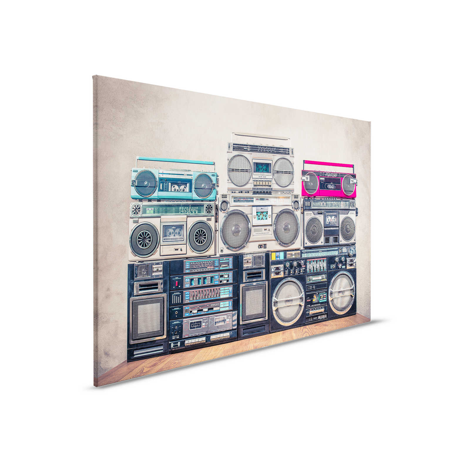         Canvas painting Radios on wooden table in front of wall - 0,90 m x 0,60 m
    