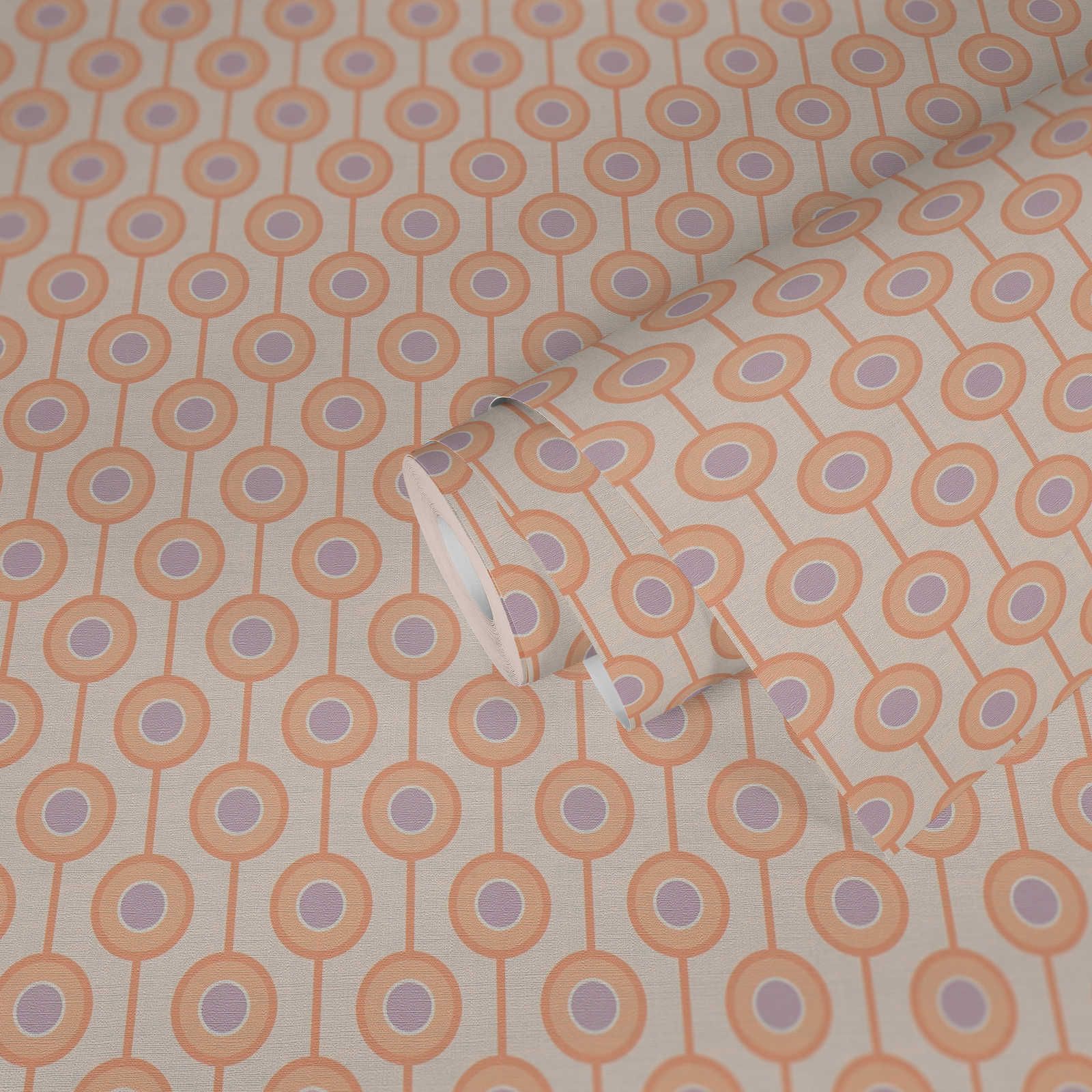             Papel pintado no tejido con motivos circulares en colores suaves - beige, naranja, morado
        