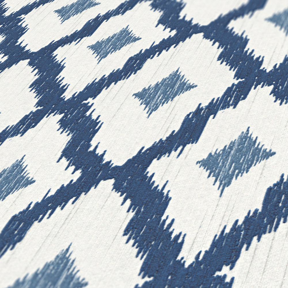             Non-woven wallpaper ikat pattern with diamonds motif - blue, white
        