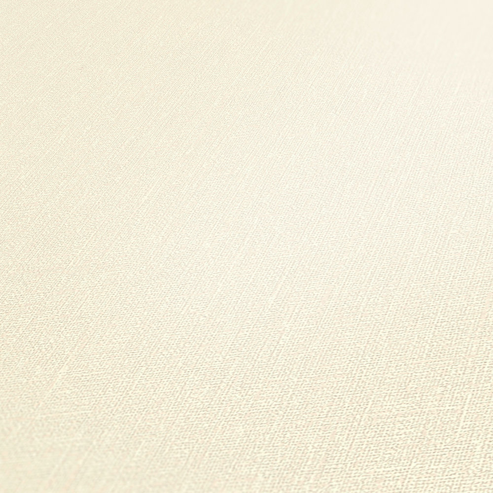             Vliesbehang crème met textielstructuur in linnenlook
        