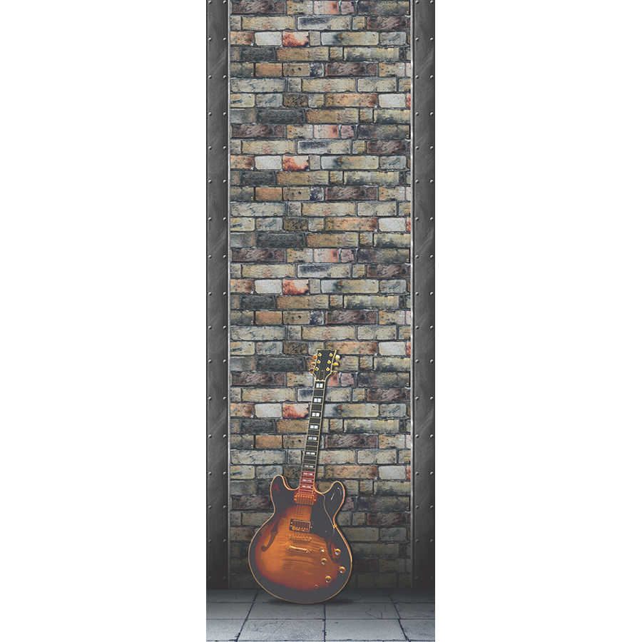 Mural moderno de guitarra frente a la pared de piedra sobre tejido no tejido con textura
