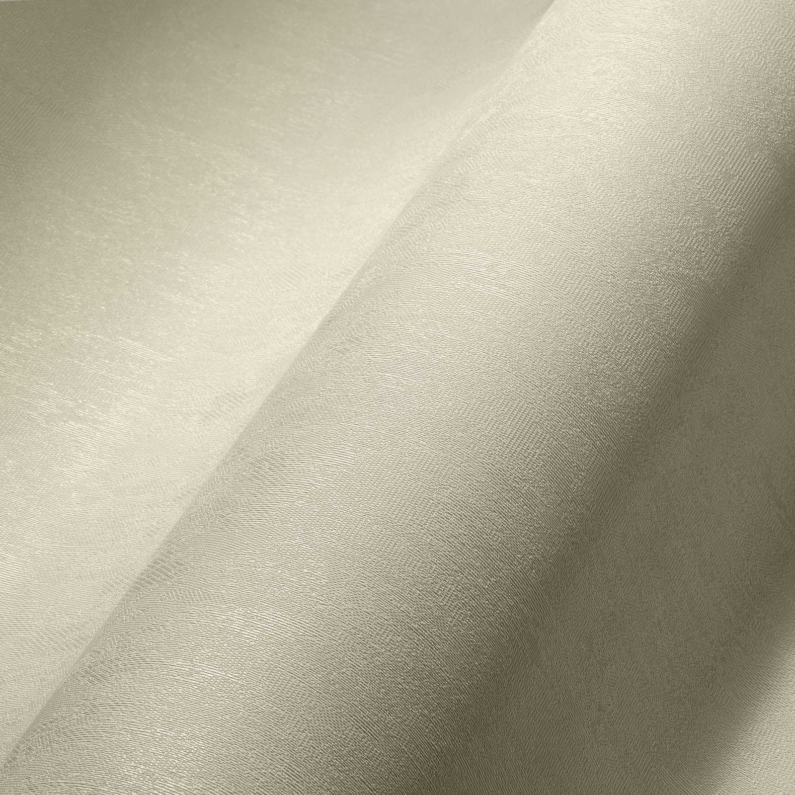             Papel pintado no tejido blanco crema liso con superficie texturizada
        