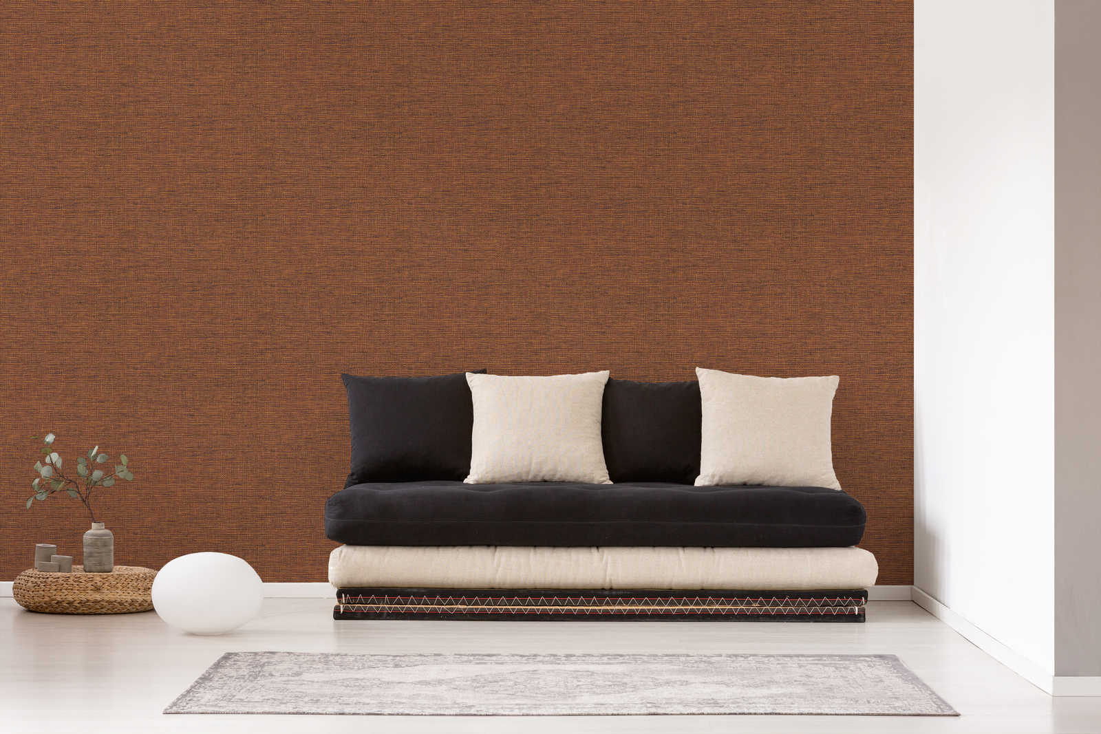             Ethno wallpaper orange-brown with raffia fabric look
        