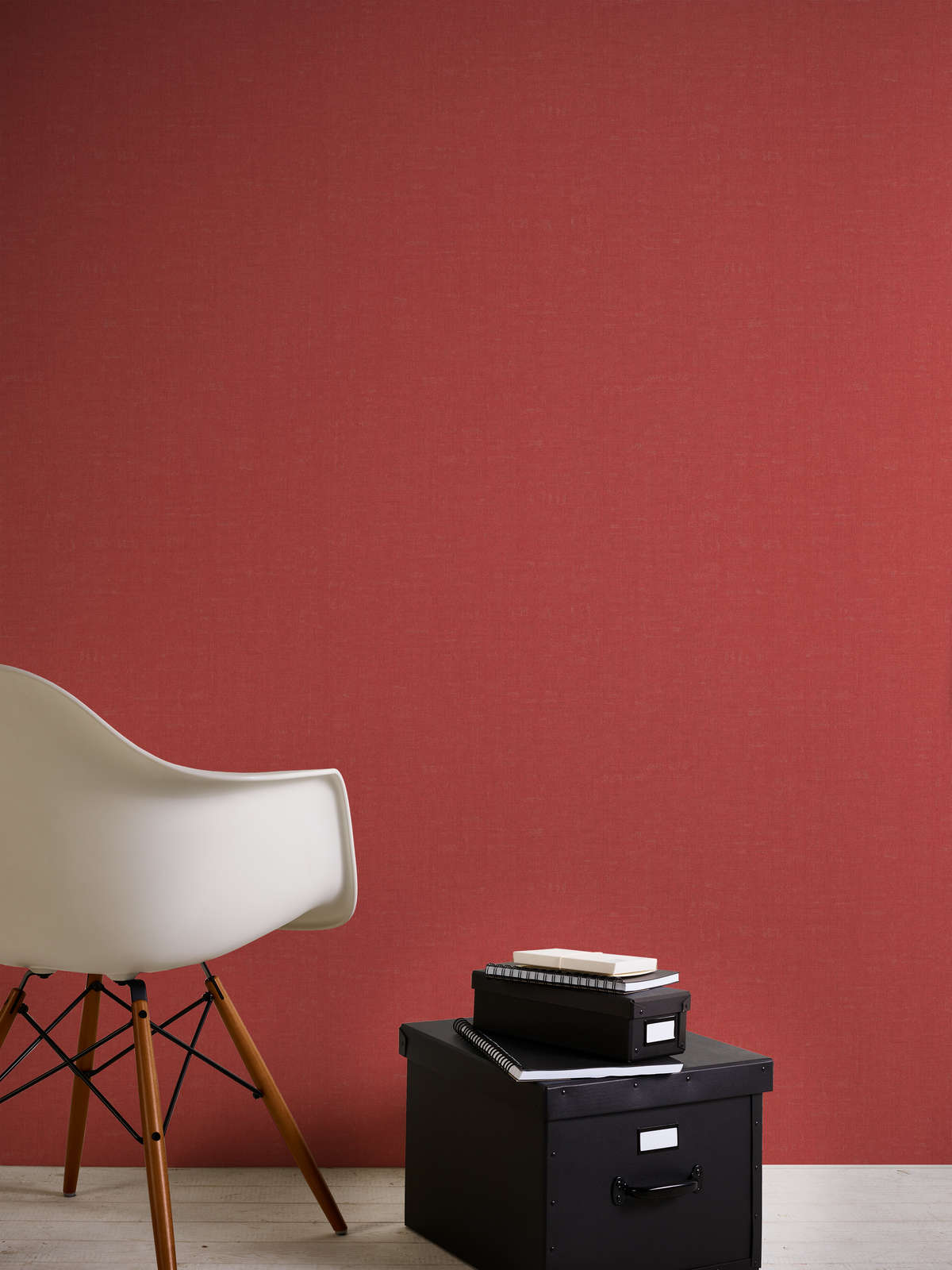             Red wallpaper plain and mottled with texture embossing
        