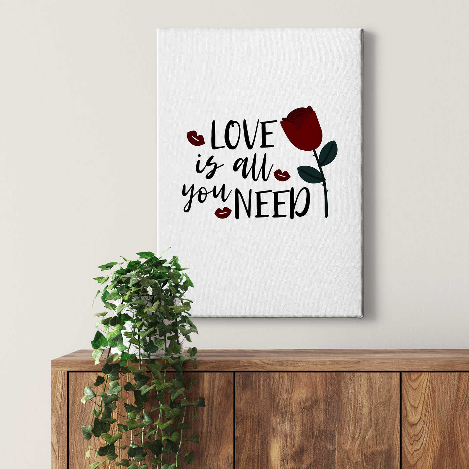             Canvas print saying love is all you need – black and white
        