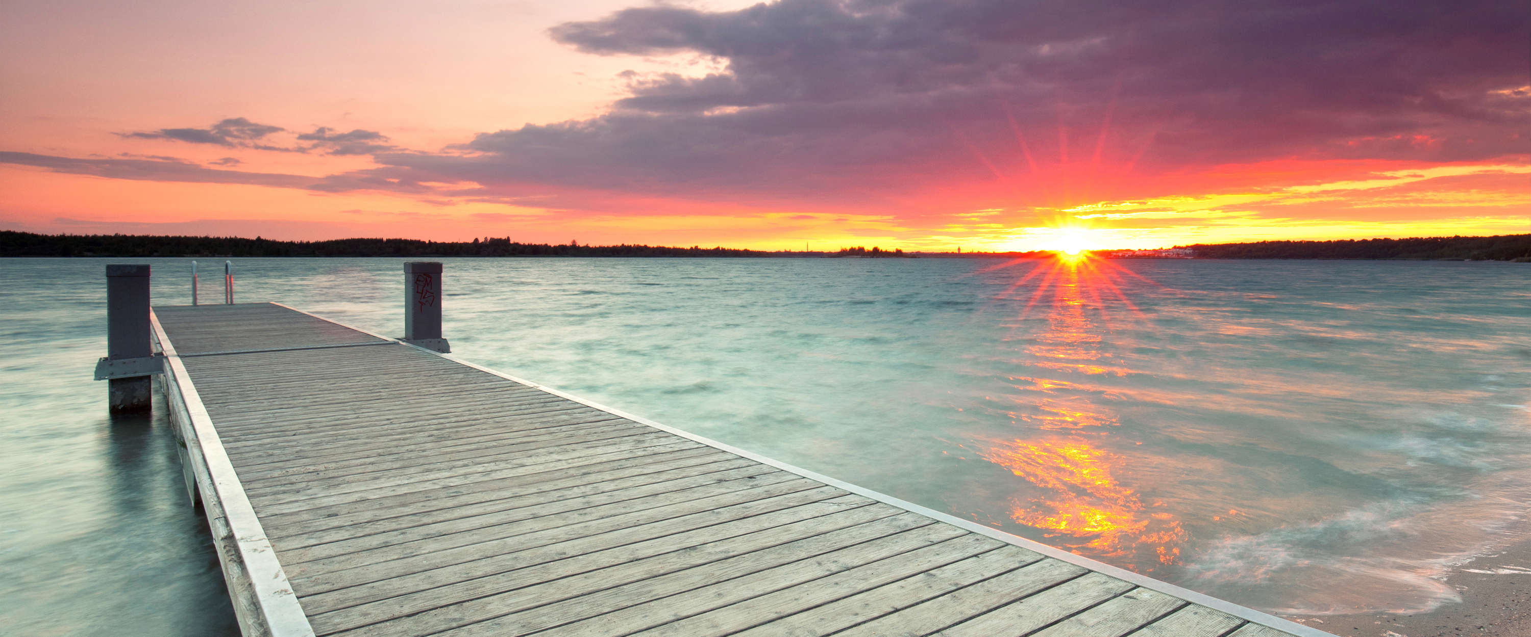            Photo wallpaper wooden jetty in the water at sunset
        