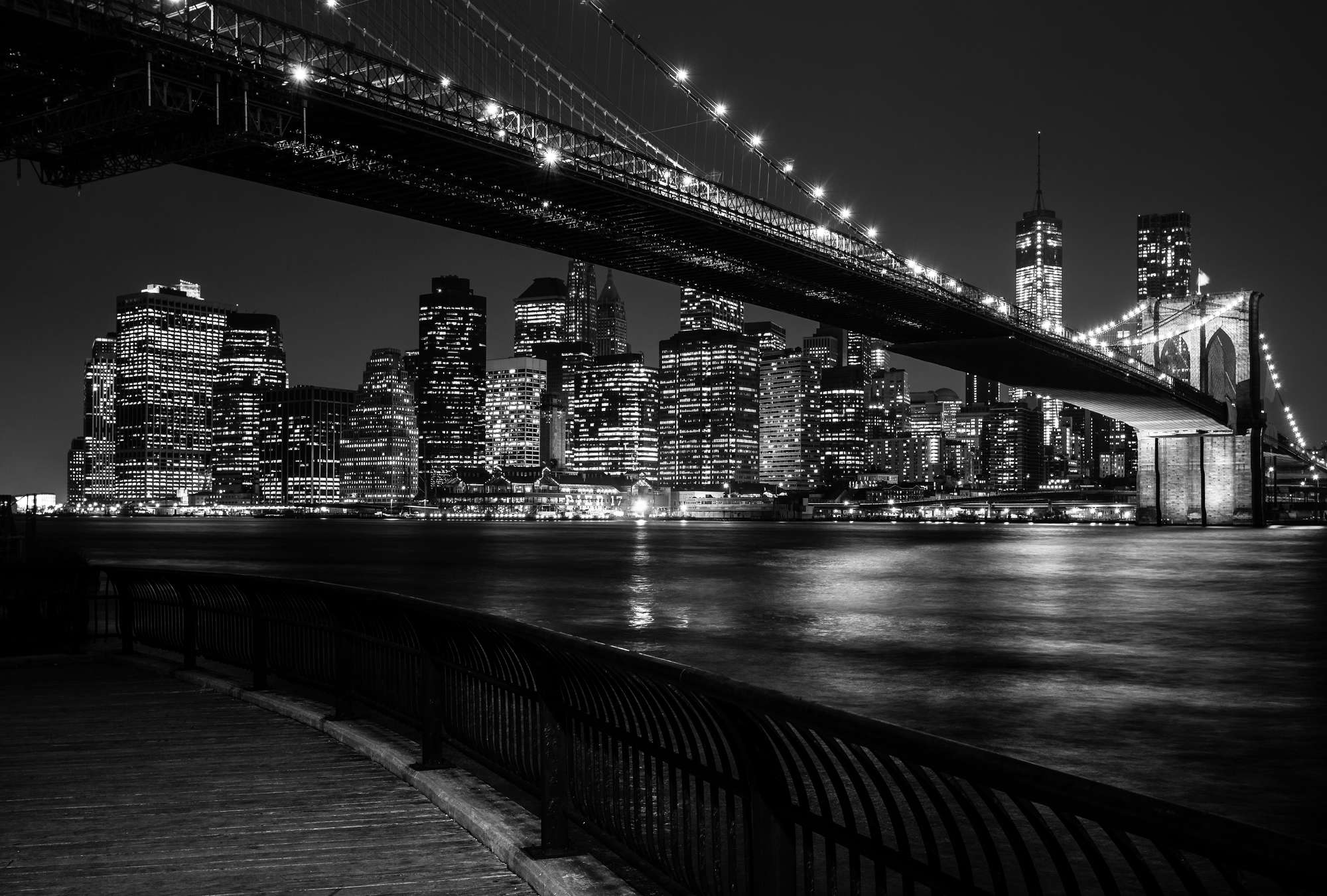            Brooklyn Bridge mural at night - black and white
        