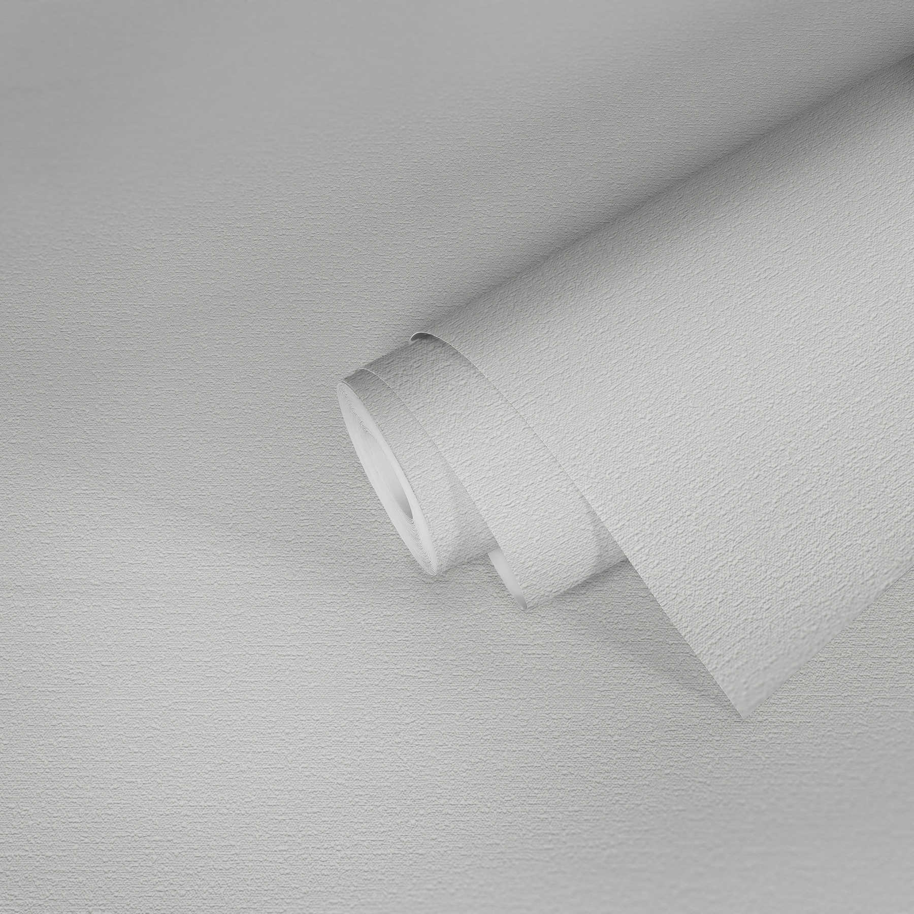            Papel pintado blanco con estructura de aspecto textil
        