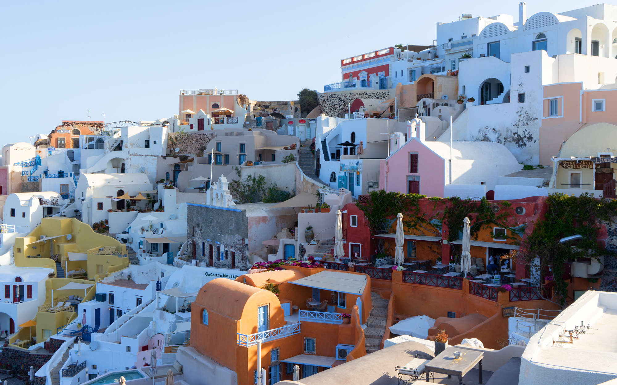             Santorini huizen muurschildering - parelmoer glad vlies
        