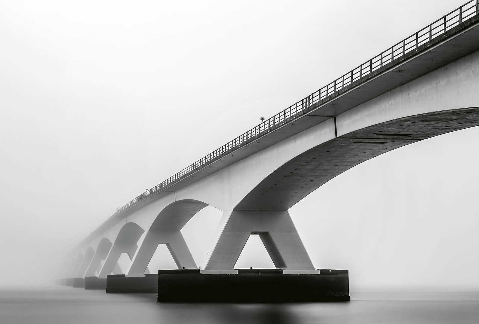         Photo wallpaper bridge in the fog - grey, white, black
    