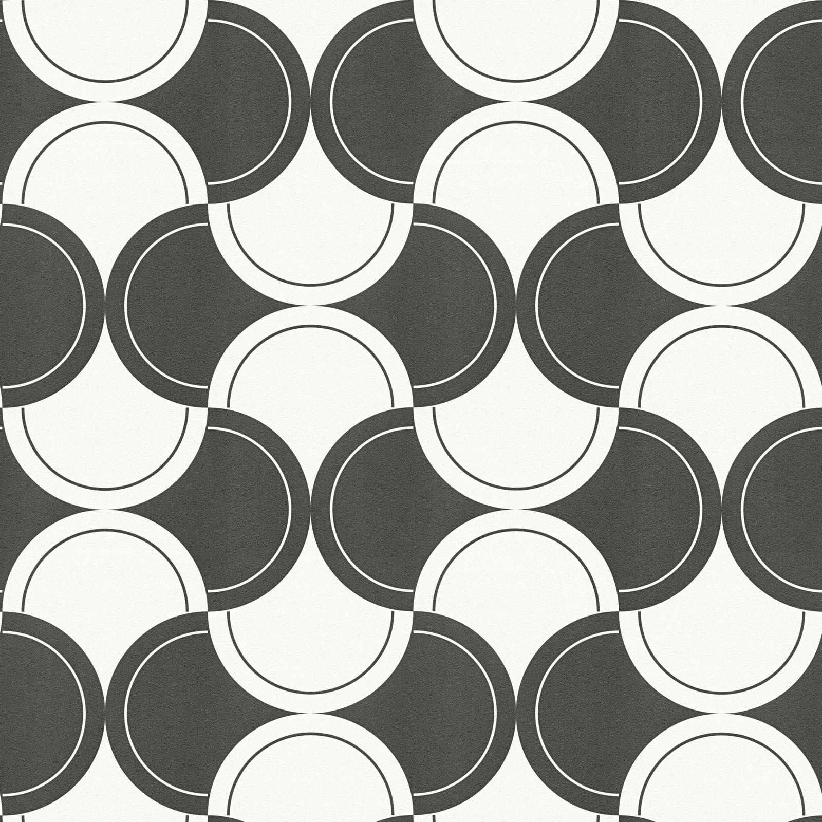             Papel pintado no tejido motivo retro con círculos estilo años 70 - blanco y negro
        