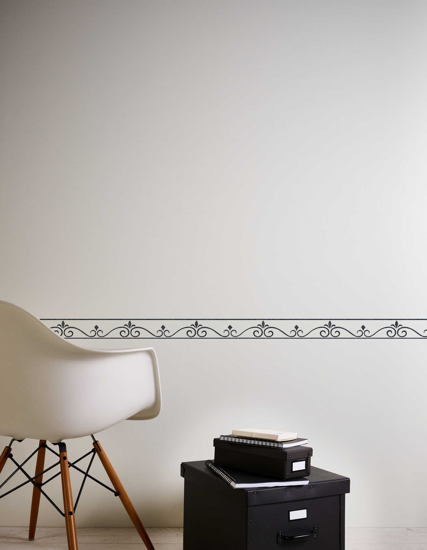             Black and white border with filigree decorative pattern
        